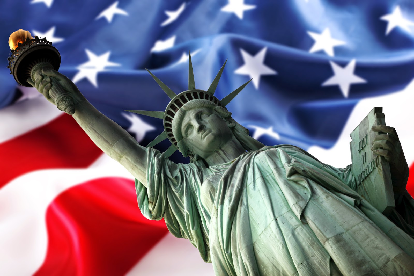 Statue-of-Liberty-Against-Large-Flag